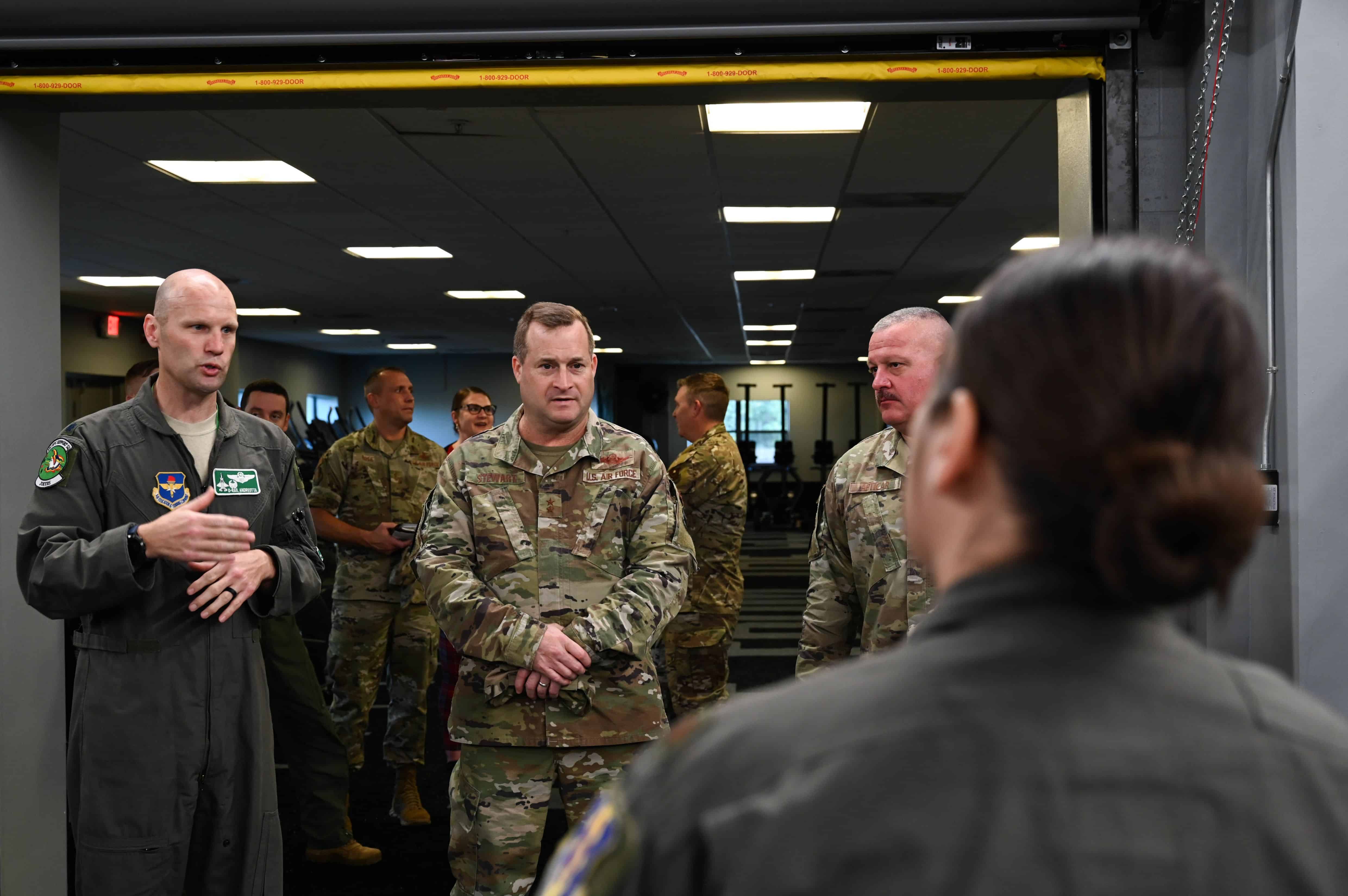 Maj. Gen. Phillip Stewart, commander of 19th Air Force, Joint Base San Antonio-Randolph, Texas, is briefed by U.S. Air Force Maj. Stephanie Chayrez, flight commander, human performance, 33rd Fighter Wing, at Eglin Air Force Base, Florida, Nov. 30, 2022. Stewart toured the 33rd FW to learn about the wing’s mission and commemorate exceptional Airmen. (U.S. Air Force photo by Airman Christian Corley)