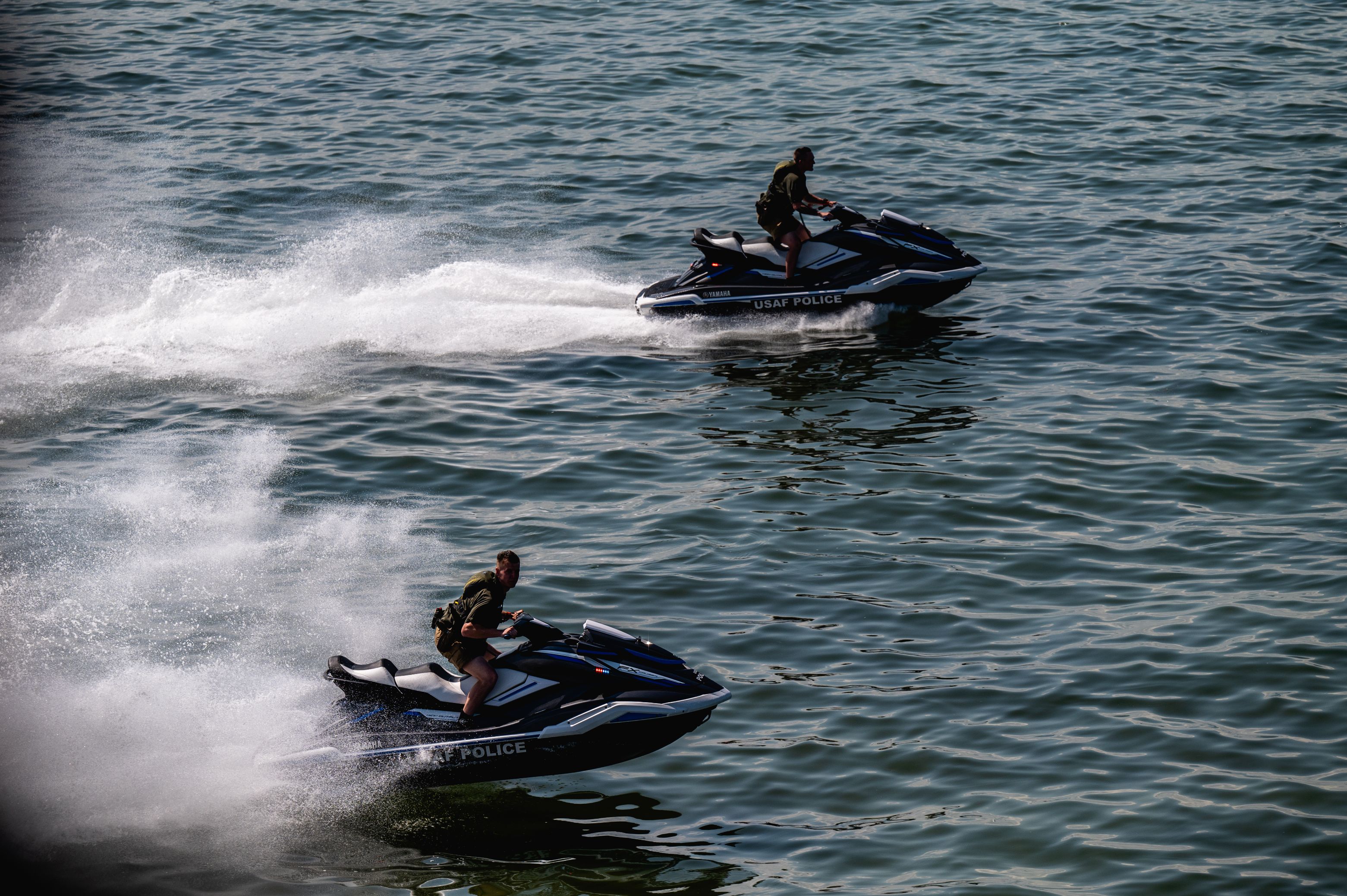 U.S. marine patrolmen assigned to the 6th Security Forces Squadron operate jet skis in Hillsborough Bay, Florida, during Operation Neptune Storm May 17, 2023. The operation included assets from the 6th Security Forces Squadron, U.S. Coast Guard, Tampa Fire Rescue, Florida Fish and Wildlife Commission, Tampa Police Department