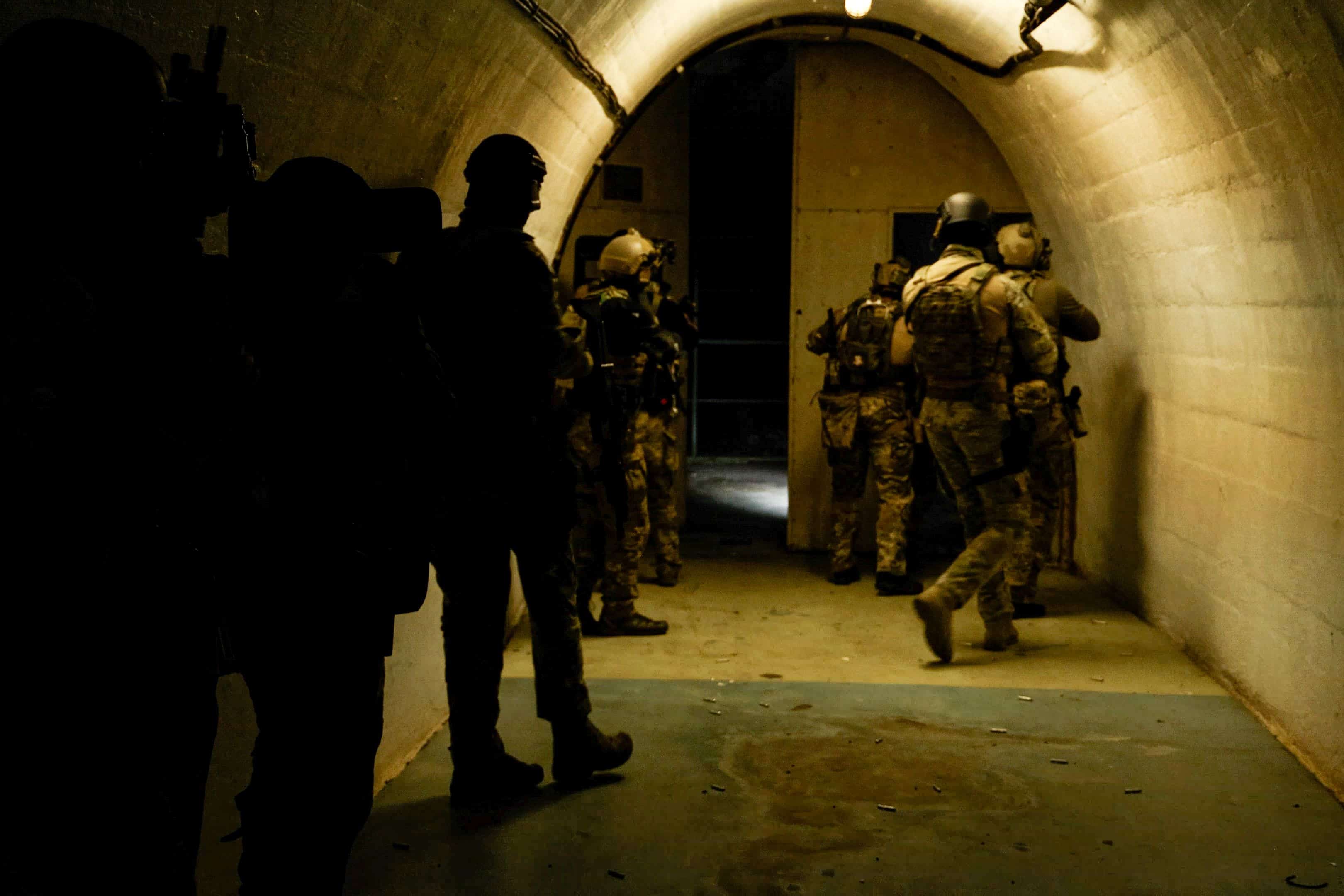 Green Berets with Critical Threats Advisory Company (CTAC), 2nd Battalion, 10th Special Forces Group (Airborne), maneuver down a hallway interlocking sectors of fire near Konjic, Bosnia-Herzegovina, May 8, 2023. U.S.