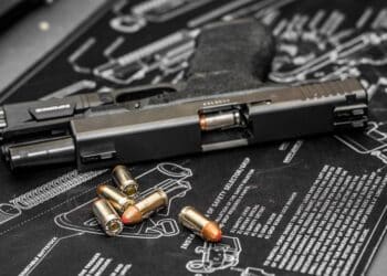 Glock 21 handgun with flash light and hollow point bullets.