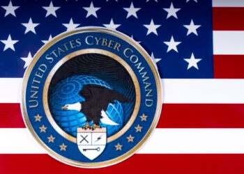 LONDON, UK - MARCH 26TH 2018: The symbol of the United States Cyber Command portrayed with the US flag, on 26th March 2018.