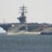 Lisbon / Portugal - June 22, 2013: USS Dwight D. Eisenhower (CVN-69) (known informally as "Ike") anchored on the entrance of the Tagus river estuary, Lisbon, Portugal.