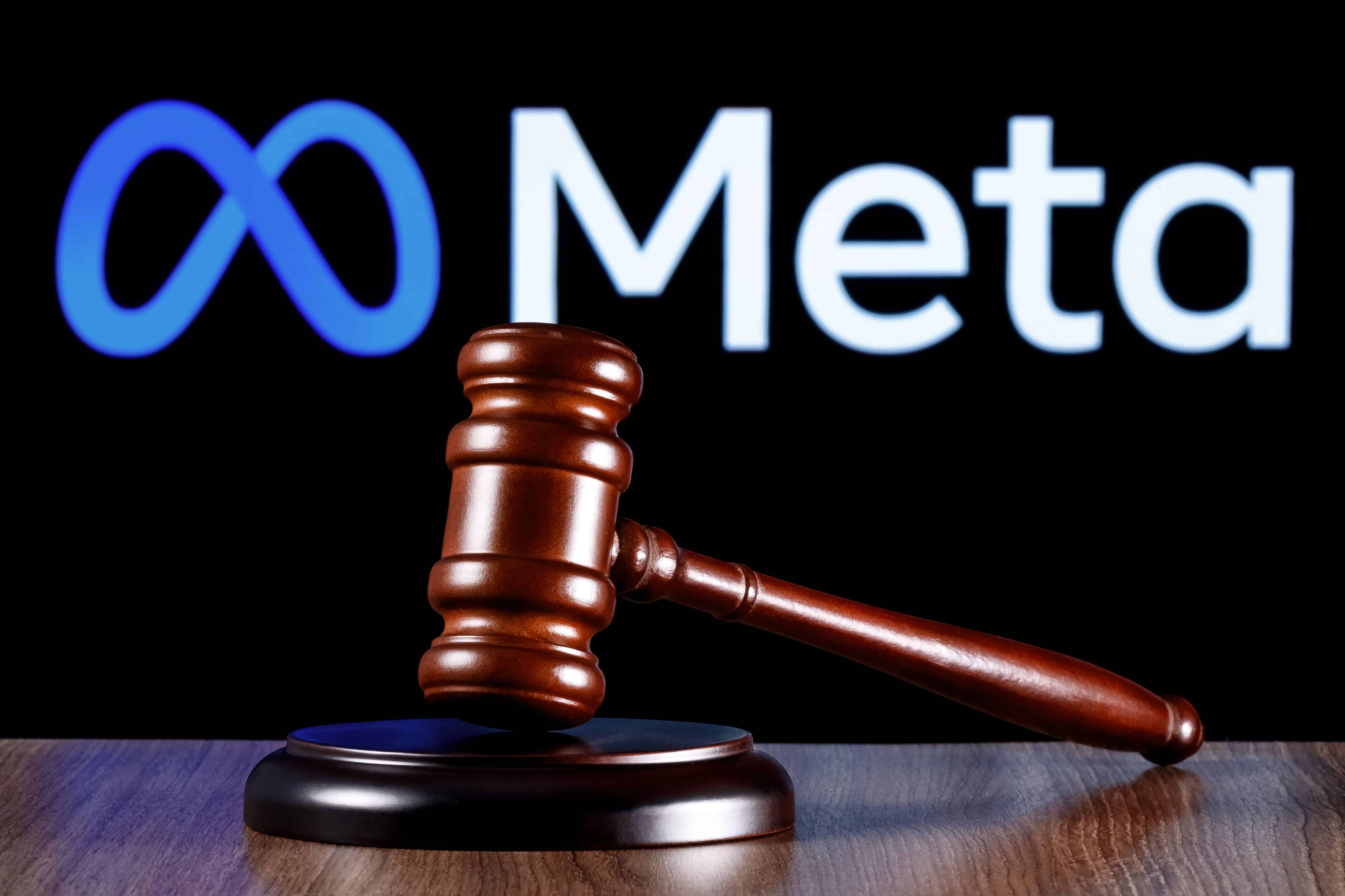 Kazan, Russia - Jan 31, 2022: Gavel on table against the background of Meta company logo. The concept of the trial.