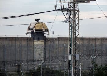 NETIV HAASARA, ISRAEL - FEBRUARY 13, 2023: Concrete fence and observation post on the border with the Gaza Strip from the side of kibbutz Netiv HaAsara