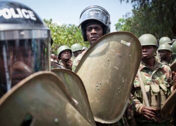Nairobi, Kenya - February 13, 2014: Color picture of a policemen holding shields