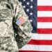 Male army soldier on American flag background