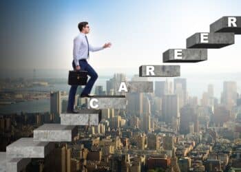 Businessman climbing career ladder in business concept