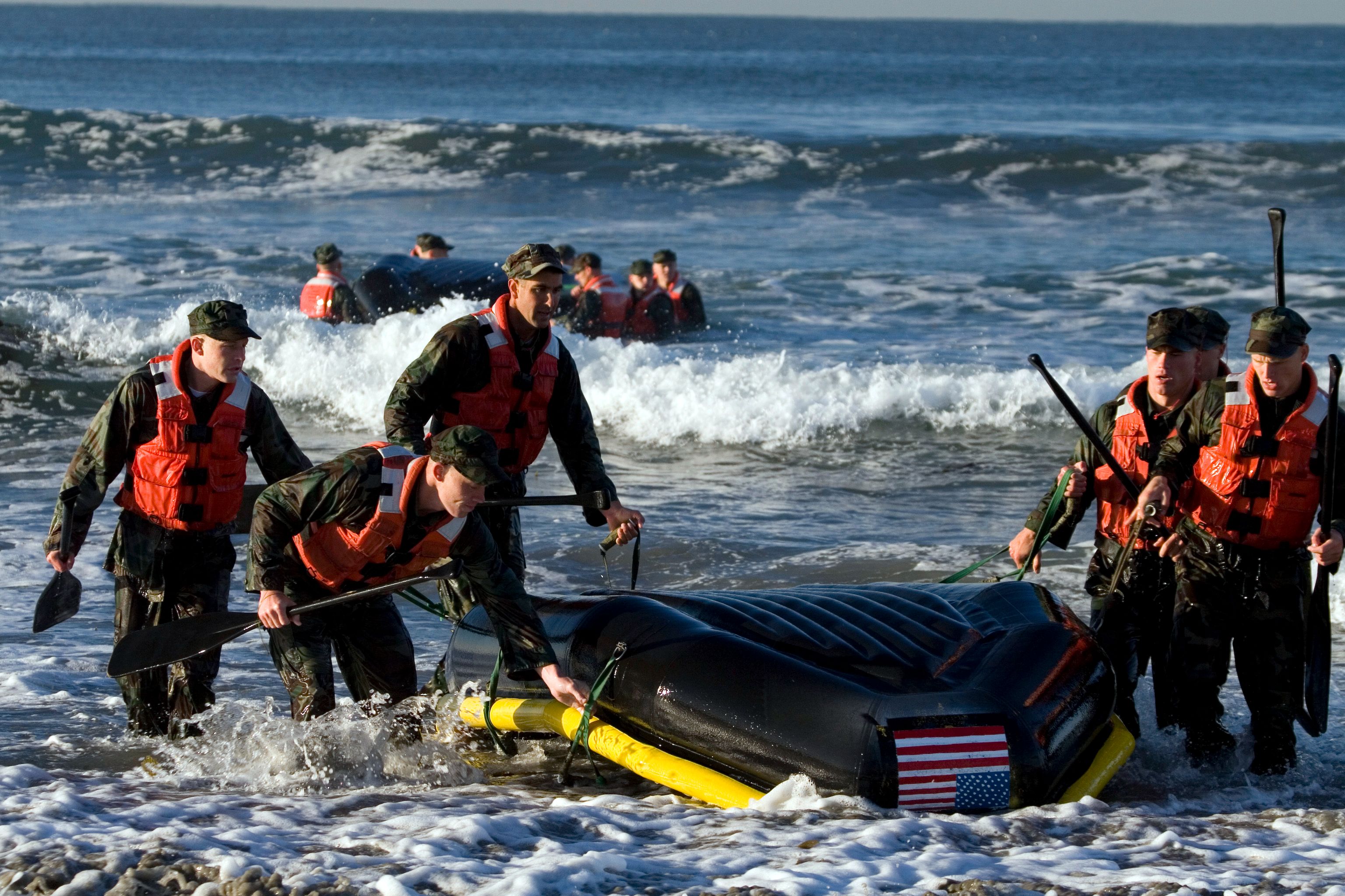 Basic Underwater Demolition/ SEAL (BUDS) students drag their boat back to shore during their first Surf Passage at the Naval Special Warfare Center at the Naval Amphibious Base Coronado. This is one of many evolutions during the first phase of BUDS training where students are tested both mentally and physically to prepare them for life as a special operator. (U.S. Navy photo by Mass Communication Specialist 3rd Class Blake R. Midnight (Released)