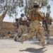 Iraqi Special Operations Forces soldiers in full combat gear sprint for approximately a quarter of a mile during the Special Forces Challenge that took place on a military base in the Baghdad area on June 2. The average Soldier carries about 60 pounds during routine patrols.