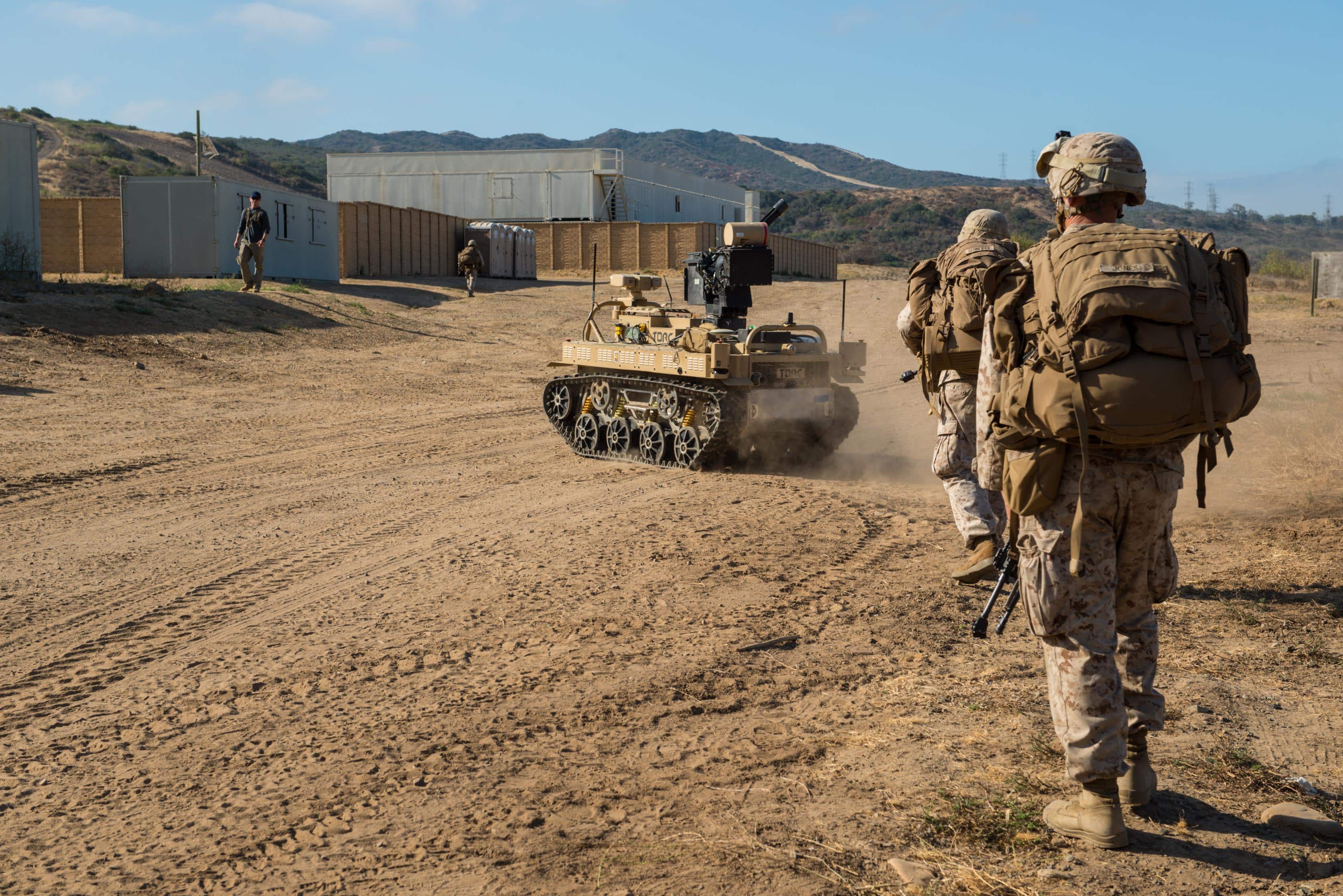 Marines with 3rd Battalion, 5th Marine Regiment conduct a patrol with a Weaponized Multi-Utility Tactical Transport vehicle at Marine Corps Base Camp Pendleton, Calif., July 13, 2016.