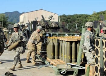 Soldiers from Alpha Battery, 1st Battalion, 82nd Field Artillery Regiment, 1st Armored Brigade Combat Team, 1st Cavalry Division, draw 155mm Base Burn Dual Purpose Improved Conventional Munition rounds, each weighing nearly 100 pounds, and carry into their vehicles during a load exercise directed by the 210th Field Artillery Brigade, 2nd Infantry Division. (U.S. Army photo by 2nd Lt. Gabriel Jenko, 1st Battalion, 82nd Field Artillery Regiment, 1st Armored Brigade Combat Team, 1st Cav. Div.)