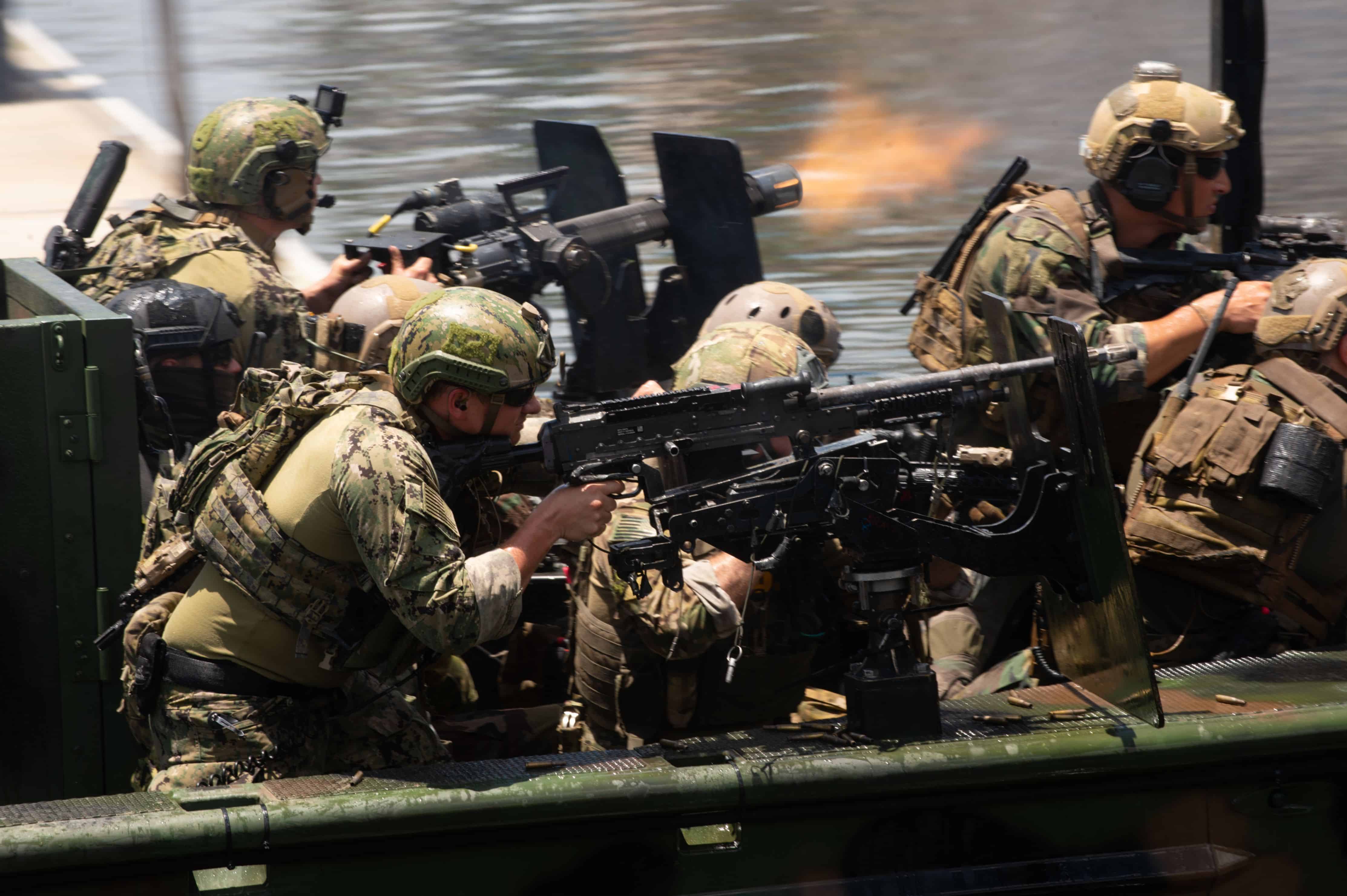 Multinational Special Operations Forces conduct an amphibious assault from a Special Operations Craft – Riverine boat during a capabilities demonstration as part of the 2018 International Special Operations Forces week in downtown Tampa, Fla., May 23, 2018. ISOF is the premier conference for the SOF community to advance the understanding of international SOF challenges. (Photo by U.S. Air Force Master Sgt. Barry Loo)