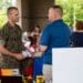 U.S. Marine Corps Sgt. Maj. Dustin Nelson, sergeant major, Wounded Warrior Battalion-East, meets with different booths raising awareness for post-traumatic stress disorder during the Lin Weidow Memorial, Camp Lejeune, N.C., May 24, 2018. Members of WWBn-E memorialized a cherished colleague, known for her outstanding dedication in helping recovering service members and having a positive impact on her peers. (U.S. Marine Corps photo by Lance Cpl. Ashley Gomez)