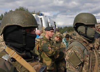Ukraine soldiers look intently, as the Red Cross instructor gives directions on casualty care during the medical situational training exercise as part of Rapid Trident 2019 in Yavoriv, Ukraine, Sept. 19, 2019.