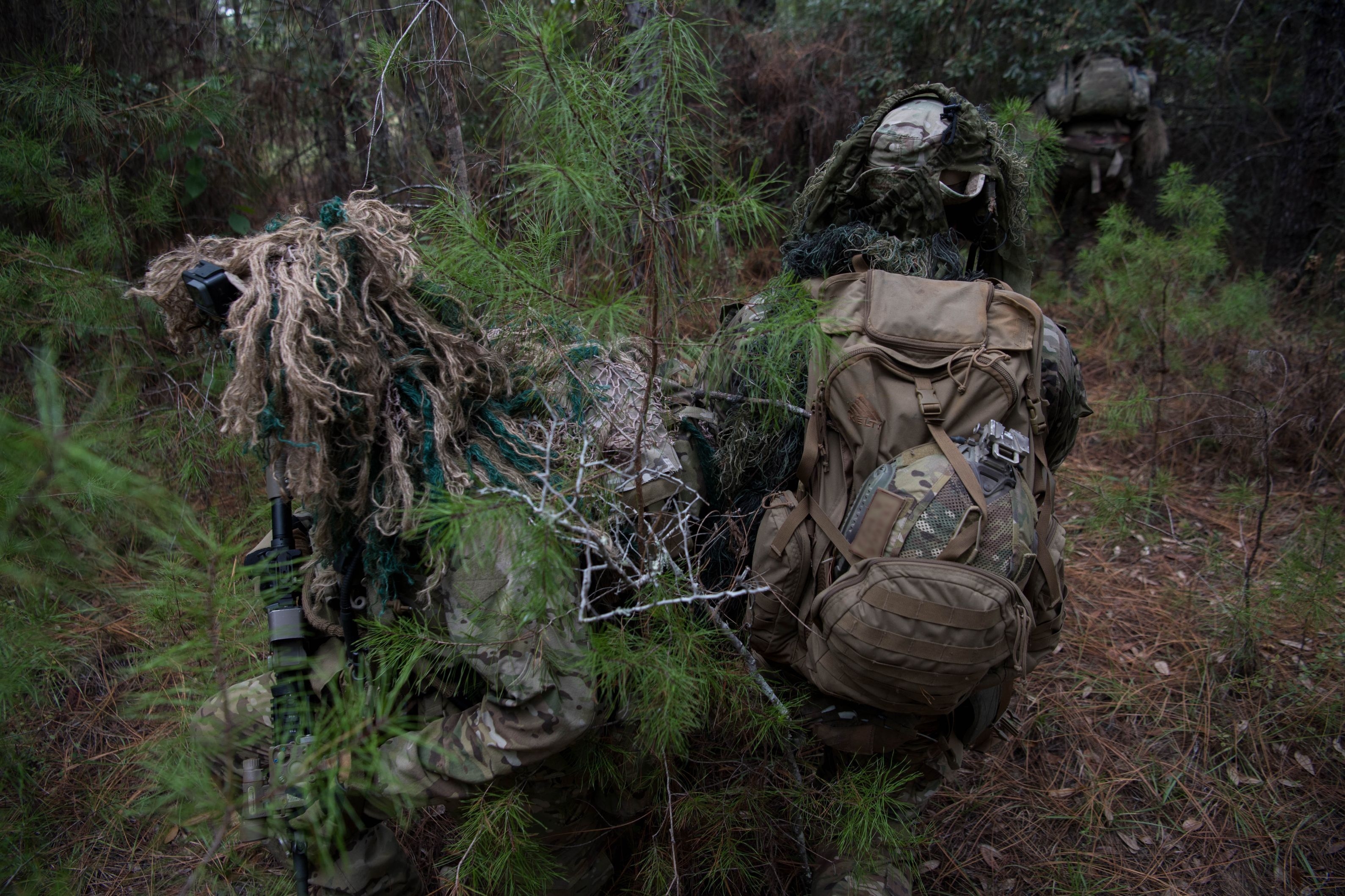 U.S. Air Force Special Tactics operators set up security while a teammate moves into a hide site during a full mission profile as part of a beta Special Reconnaissance course near Hurlburt Field, Florida, Sept. 25, 2019.