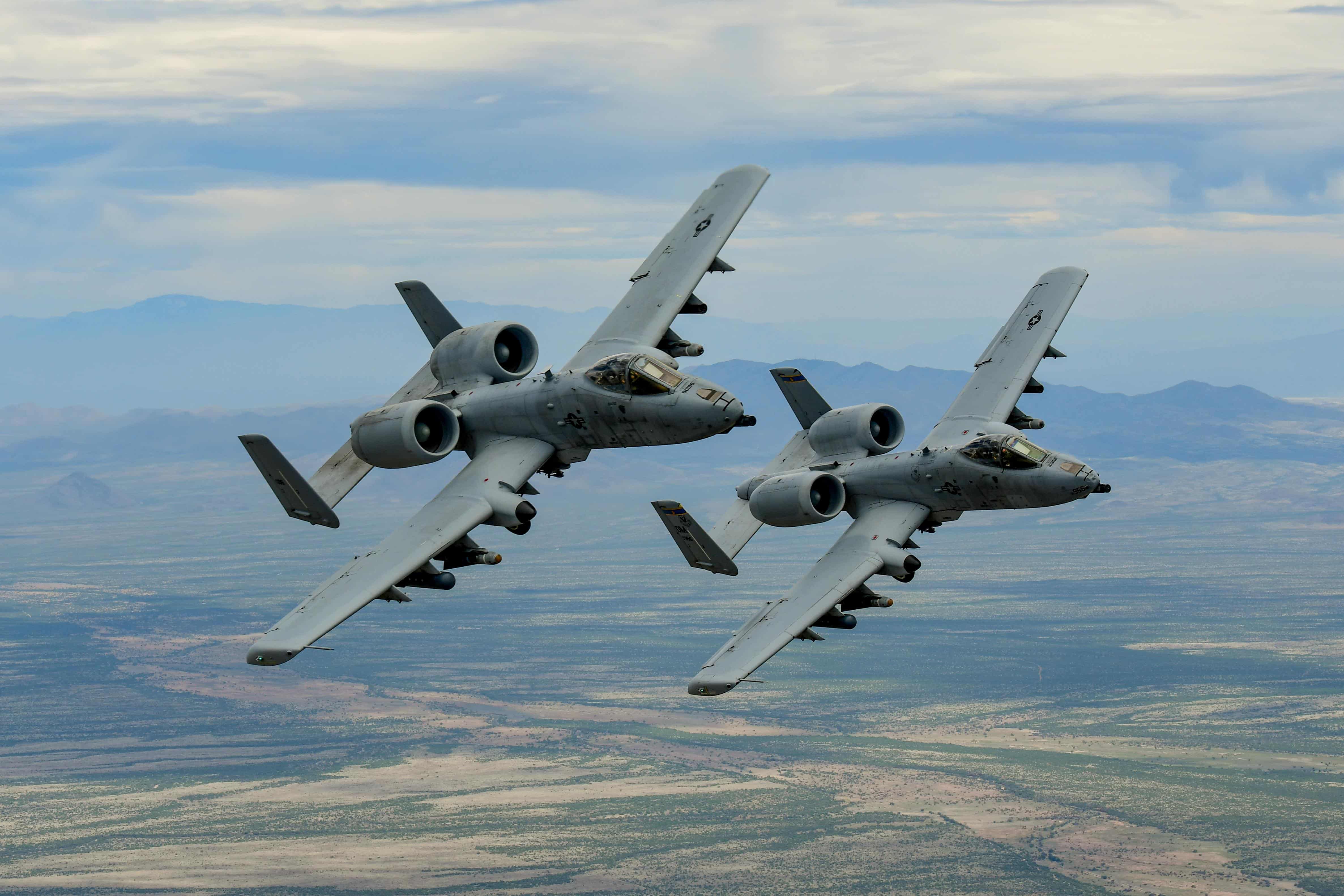 Two A-10 Thunderbolt IIs fly in formation over southern Arizona, April 29, 2019. The A-10s are assigned to the 355th Wing at Davis-Monthan Air Force, Arizona, which is home to a variety of combat-ready Airmen and assets. (U.S. Air Force photo by Staff Sgt. Betty R. Chevalier)