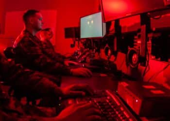 Marines with Marine Corps Forces Cyberspace Command pose for photos in cyber operations room at Lasswell Hall aboard Fort Meade, Maryland, Feb. 5, 2020. MARFORCYBER Marines conduct offensive and defensive cyber operations in support of United States Cyber Command and operate, secure and defend the Marine Corps Enterprise Network.