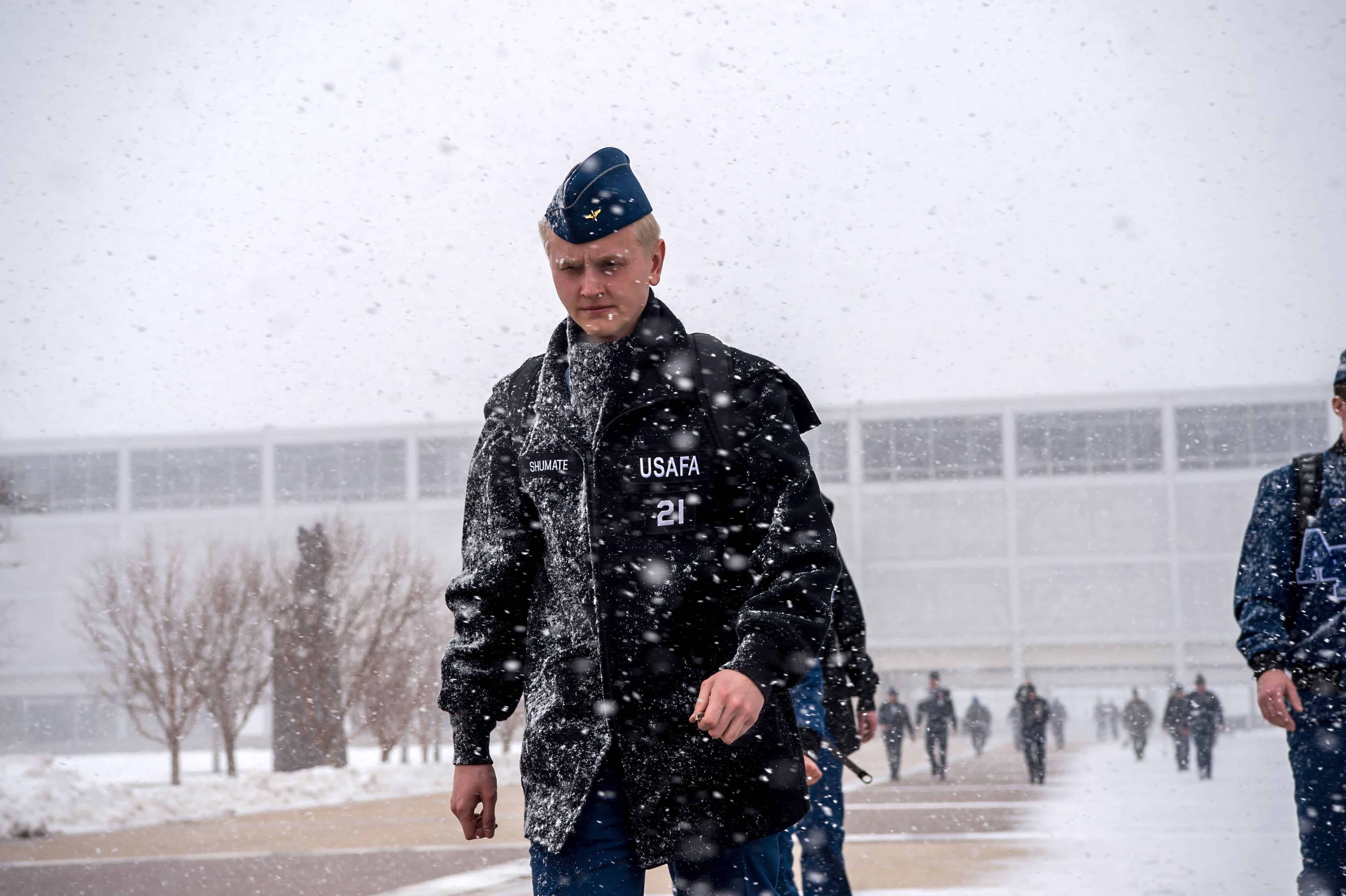 U.S. AIR FORCE ACADEMY, Colo. – Cadets cross the Terrazzo braving winter weather caused by a sudden snow squall on Feb. 24, 2020 at the U.S. Air Force Academy. (U.S. Air Force photo/Trevor Cokley)