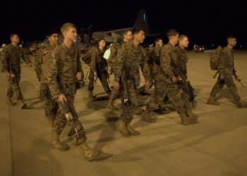 U.S. Marines with Company F, 2nd Battalion, 3rd Marine Regiment, 3rd Marine Division, III Marine Expeditionary Force, walk across the tarmac at Royal Australian Air Force Base Darwin after returning to Australia June 26. During the remaining months of its deployment in Darwin, the Marine rotational force will conduct bilateral martial arts training, small unit operations, and other combat training with various supporting elements, all in close cooperation with the Australian Army’s 1st Brigade, based at Robertson Barracks.