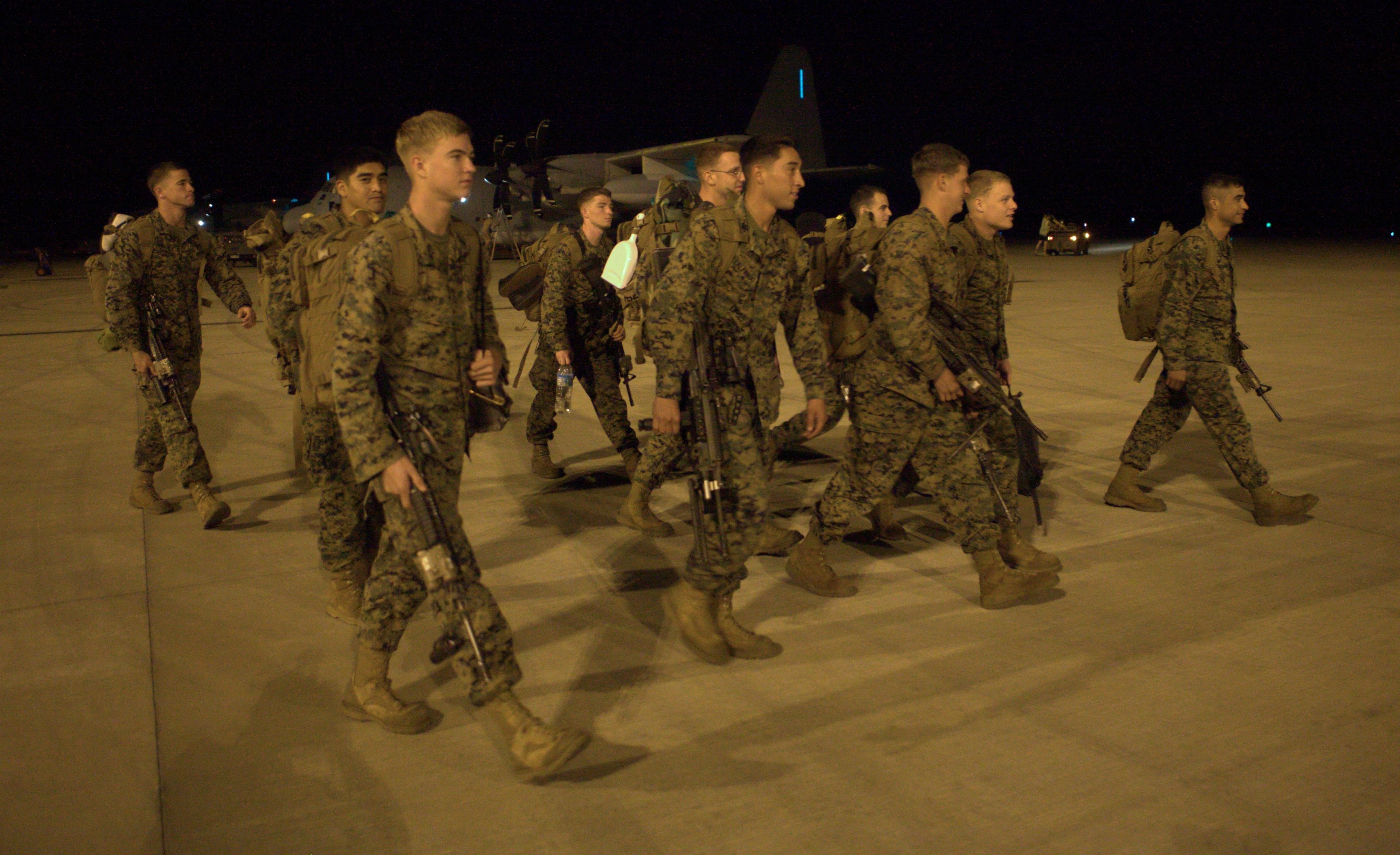 U.S. Marines with Company F, 2nd Battalion, 3rd Marine Regiment, 3rd Marine Division, III Marine Expeditionary Force, walk across the tarmac at Royal Australian Air Force Base Darwin after returning to Australia June 26. During the remaining months of its deployment in Darwin, the Marine rotational force will conduct bilateral martial arts training, small unit operations, and other combat training with various supporting elements, all in close cooperation with the Australian Army’s 1st Brigade, based at Robertson Barracks.
