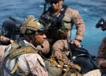 U.S. Marine Corps Sgt. Douglas Bedford, a scout with Co. A, 1st Reconnaissance Battalion, 1st Marine Division, embarks on a combat rubber raiding craft to conduct amphibious raid rehearsals off the coast of Marine Corps Base Camp Pendelton, California, July 8, 2021 Amphibious raid rehearsals are a part of continuous training for reconnaissance Marines to ensure proficiency in small boat handling. (U.S Marine Corps photo by Cpl. Frank Webb)