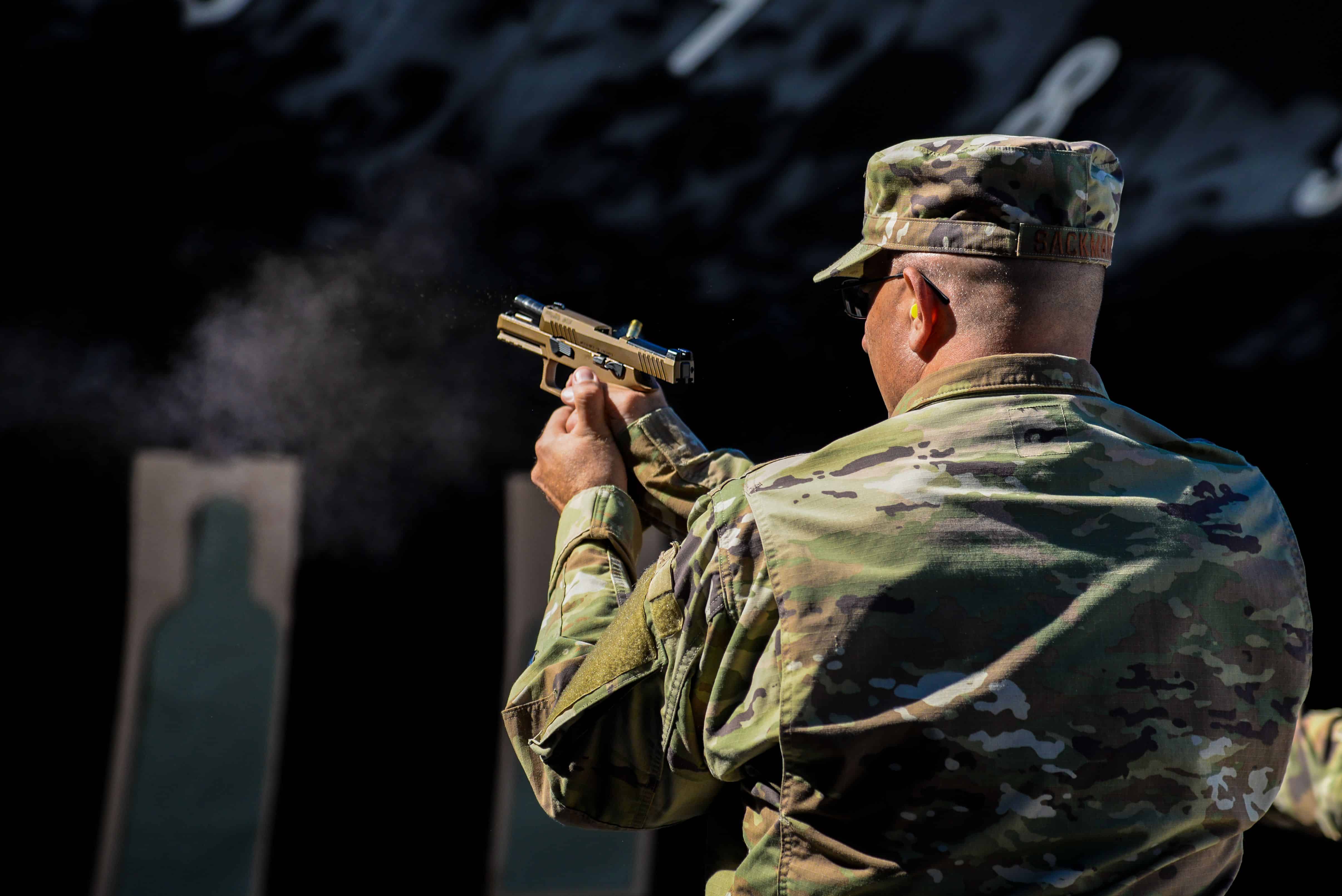 U.S. Air Force Col. Raymond A. Sackman, 177th Fighter Wing inspector general (detail), fires a SIG Sauer P320-M18 handgun Sep. 24, 2021, at the FAA William J. Hughes Technical Center, Egg Harbor Township, N.J. Members of the 177th FW went to the range to qualify for the M18 and gain the perspective of the Airmen who will carry it. (U.S. Air National Guard photo by Senior Airman Hunter Hires)