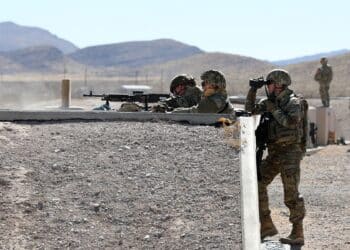 An M240 machine gun team from the 268th Military Police Company, of the Tennessee National Guard fires at targets, while observed by observer coach/trainers assigned to the 3-360th Training Support Battalion, during a range training exercise at Fort Bliss, Texas. The training focused primarily on communications between the tower,