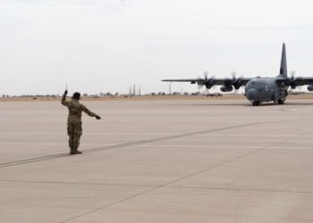 U.S. Air Force Airman 1st Class Jacob Sooter, 27th Special Operations Aircraft Maintenance Squadron crew chief, marshals the 16th Special Operations Squadrons first AC-130J Ghostrider aircraft at Cannon Air Force Base