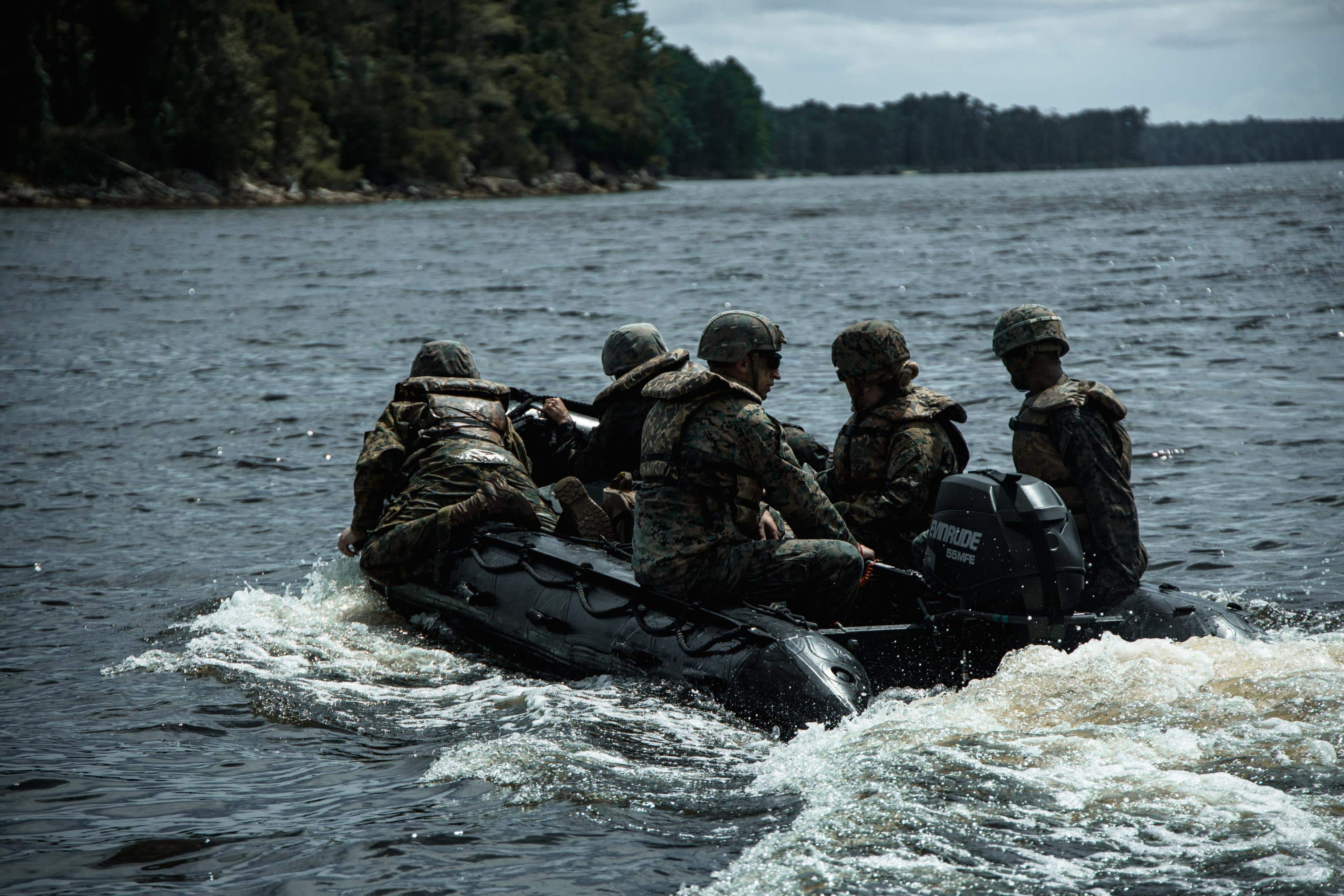 U.S. Marines with Headquarters and Service Company, 8th Engineer Support Battalion, Combat Logistics Regiment 27, depart towards a splash point on a combat rubber reconnaissance craft during Summer Pioneer 2022 at Camp Lejeune, North Carolina, July 15, 2022. Summer Pioneer 2022 is a naval engineering exercise demonstrating integrated U.S. Marine Corps and U.S. Navy formations to establish and sustain Expeditionary Advanced Bases (EAB) and Maritime Domain Awareness. (U.S. Marine Corps photo by Lance Cpl. Meshaq Hylton)
