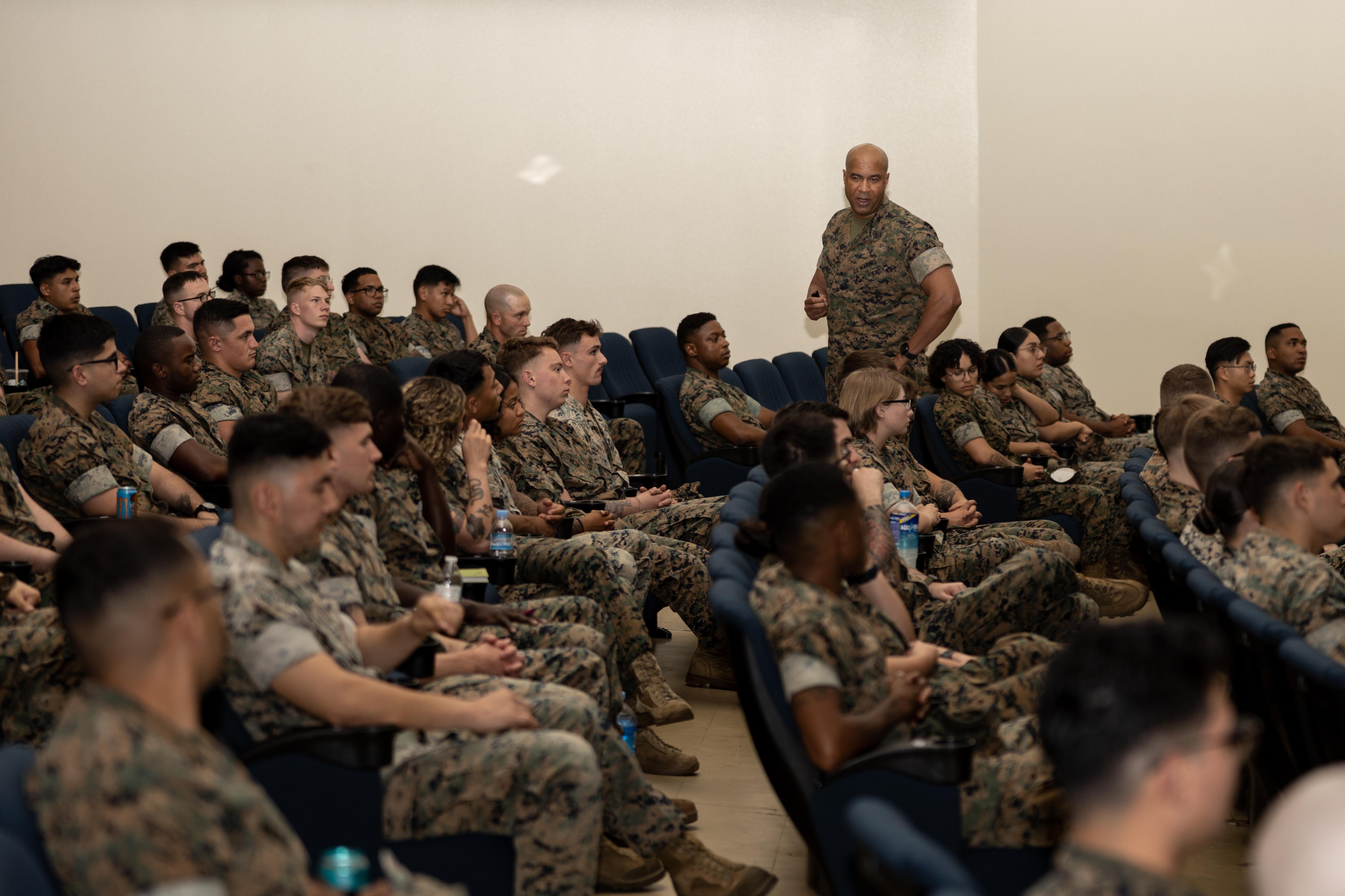 U.S. Marine Corps Master Sgt. Thomas Wallace, a career recruiter with Marine Corps Recruiting Command, informs Marines about recruiting duty at Camp Kinser, Okinawa, Japan, April 18, 2023. The purpose of the brief was to provide firsthand knowledge of recruiting duty and expand awareness of the opportunities associated with recruiting to those who are eligible. (U.S. Marine Corps photo by Lance Cpl. Sydni Jessee)