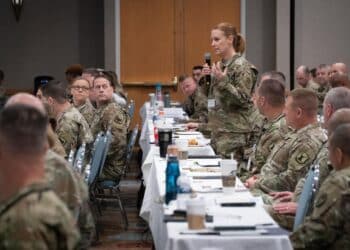 A military personnel officer asks Lt. Gen. Jon Jensen a question at the annual Army National Guard G1 Military Personnel Office workshop in Orlando, Florida, May 2 to May 4, 2023. The 2023 conference marked the first time the group has met in-person since before the COVID-19 pandemic began three years ago.