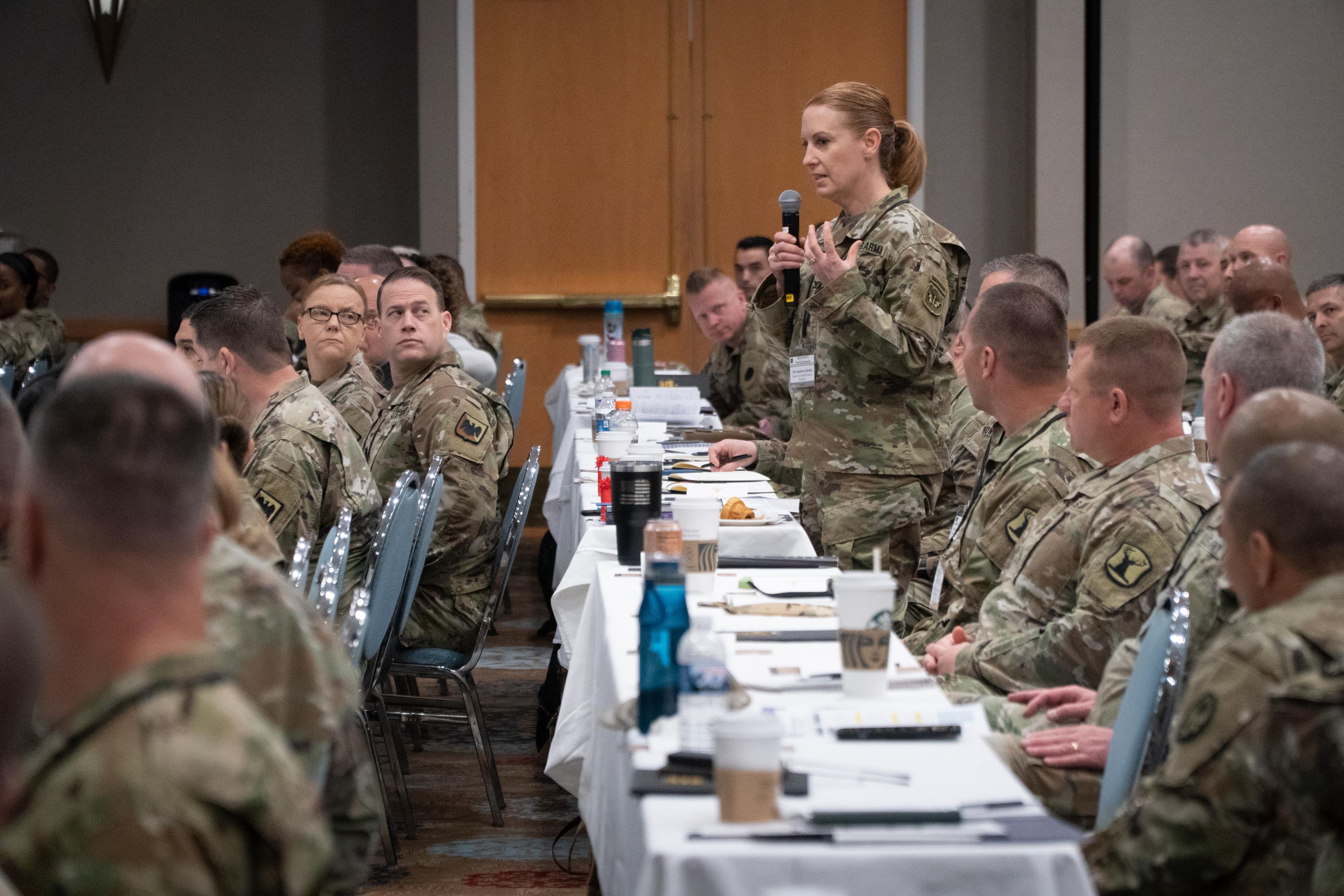 A military personnel officer asks Lt. Gen. Jon Jensen a question at the annual Army National Guard G1 Military Personnel Office workshop in Orlando, Florida, May 2 to May 4, 2023. The 2023 conference marked the first time the group has met in-person since before the COVID-19 pandemic began three years ago.