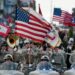 Soldiers assigned to the 101st Airborne Division (Air Assault) Honor Guard of Fort Campbell, Ky., lead the 2012 Veterans Day parade in downtown Nashville, Tenn. Thousands of veterans took part in the event which was the largest in the state. Some were on horseback, others were on motorcycles or in classic cars. Along the streets, people were lined up with their American flags and signs of support for the military. (U.S. Army Photo by Staff Sgt. Russell Lee Klika 118th MPAD)