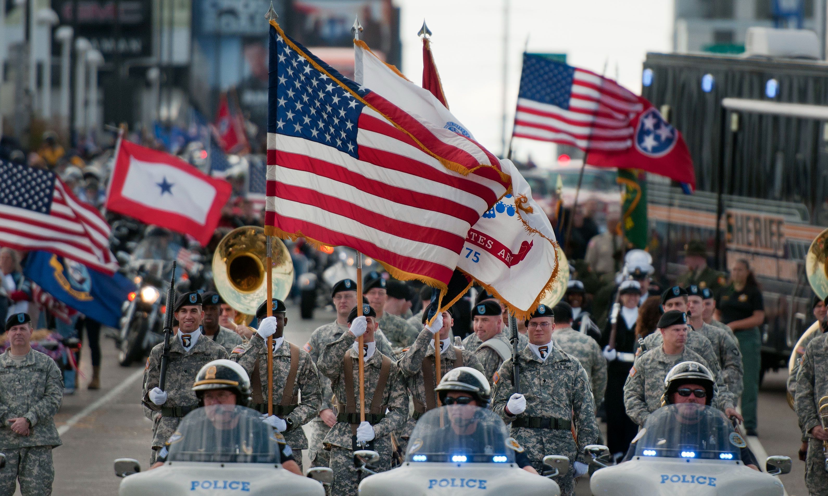 Soldiers assigned to the 101st Airborne Division (Air Assault) Honor Guard of Fort Campbell, Ky., lead the 2012 Veterans Day parade in downtown Nashville, Tenn. Thousands of veterans took part in the event which was the largest in the state. Some were on horseback, others were on motorcycles or in classic cars. Along the streets, people were lined up with their American flags and signs of support for the military. (U.S. Army Photo by Staff Sgt. Russell Lee Klika 118th MPAD)