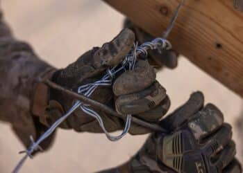 A U.S. Marine with 1st Combat Engineer Battalion, 1st Marine Division, constructs defenses during Adversary Force Exercise (AFX) 5-23 at Marine Corps Air-Ground Combat Center, Twentynine Palms, California, Aug. 9, 2023. AFX 5-23 tested the skills of Marines in seizing and maintaining a combat presence in urban environments by training in offensive and defensive tactics, conducing logistics in a contested environment, and utilizing mechanized infantry. (U.S. Marine Corps photo by Cpl. Jonathan Willcox)