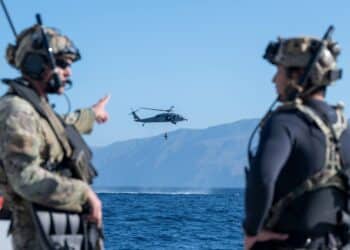 U.S. Airmen, training with the 68th Rescue Squadron, discuss mission objectives off the coast of Calif., Sept. 13, 2023. The Airmen lead their team in the treating and exfiltration of several simulated casualties. (U.S. Air Force photo by Airman 1st Class William Finn V)