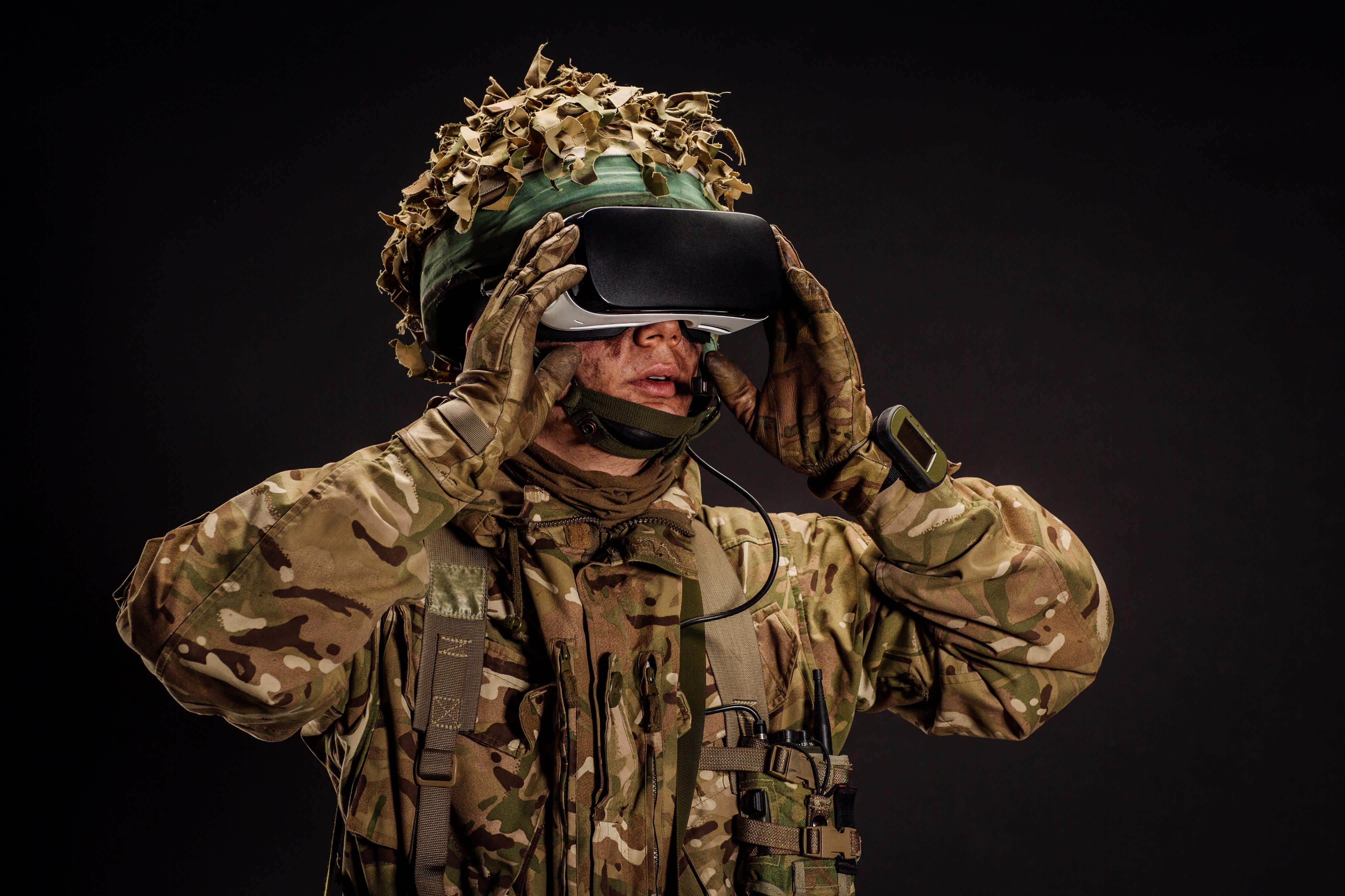 soldier use a VR glasses for combat simulation training. war, army, technology and people concept.