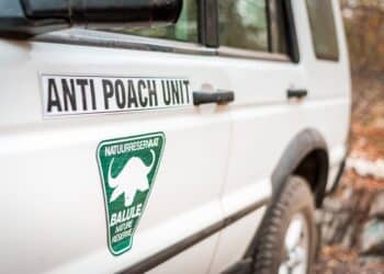 Kruger National Park, South Africa - 07 23 2016 - White SUV of the Anti Poach Unit, Association against poaching in Africa