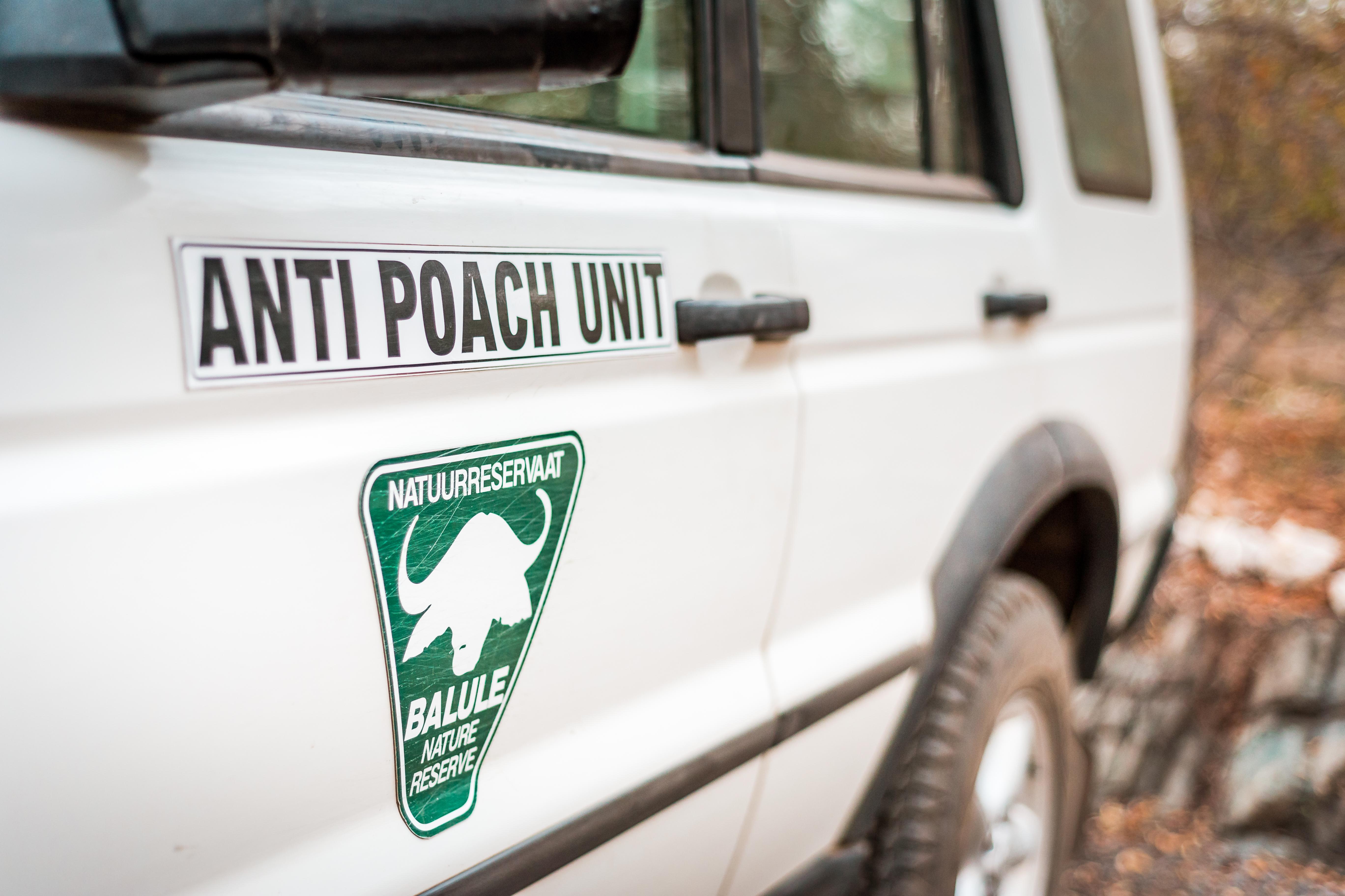 Kruger National Park, South Africa - 07 23 2016 - White SUV of the Anti Poach Unit, Association against poaching in Africa