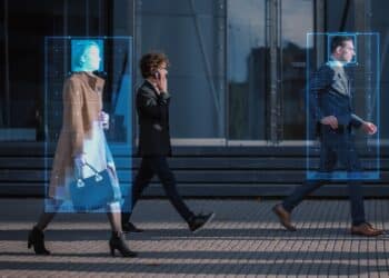 Crowd of Business People Tracked with Advanced Technology Walking on Busy Urban City Streets. CCTV AI Facial Recognition Big Data Analysis Interface Scanning, Showing Important Personal Information.