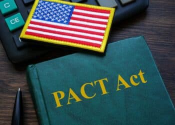 The Promise to Address Comprehensive Toxics PACT Act on the desk.