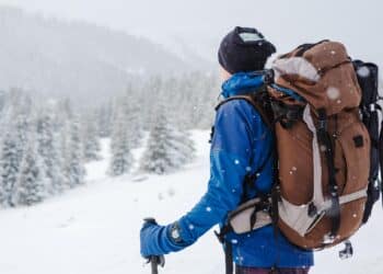 Hiker in winter mountains