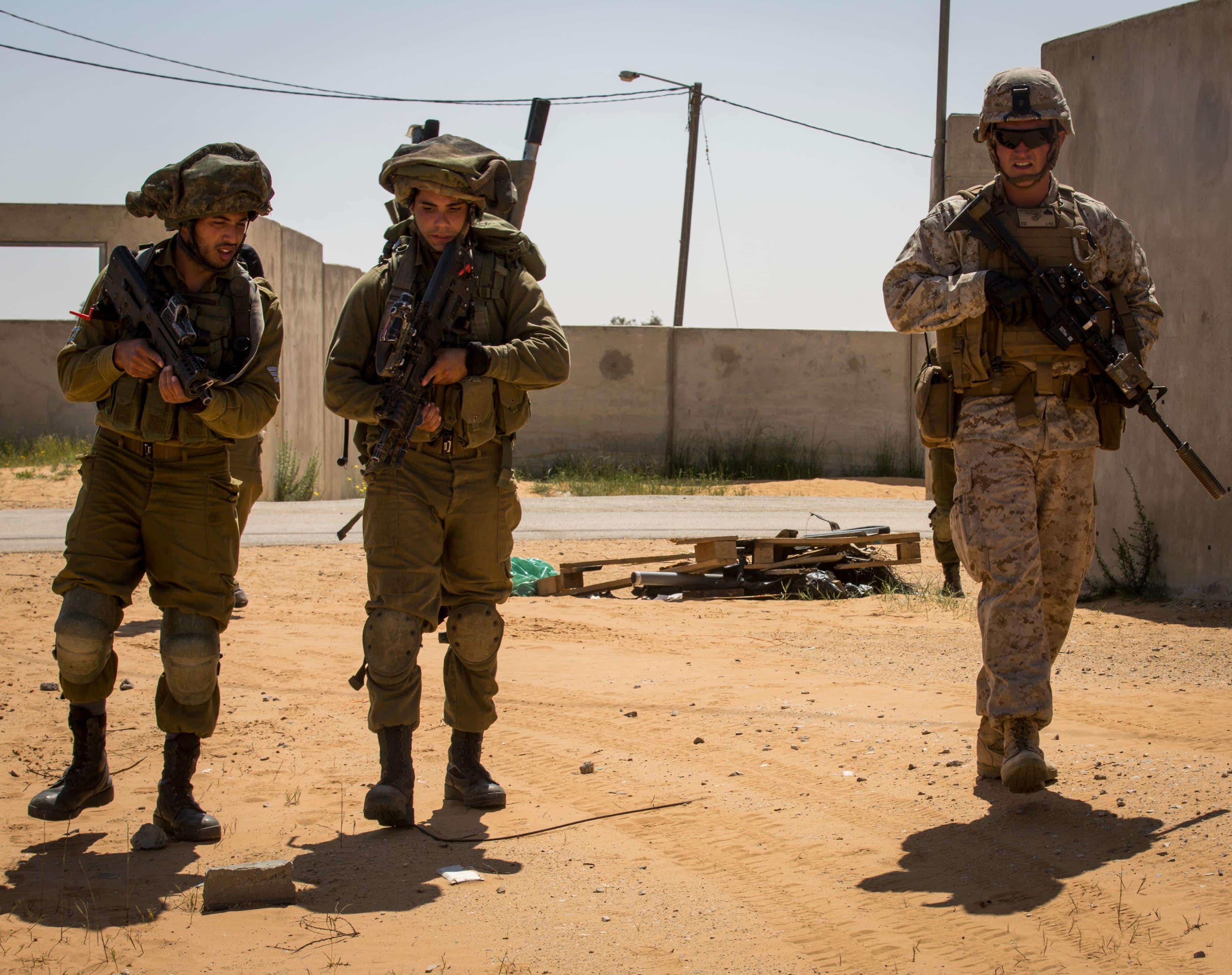 U.S. Marine Cpl. Scott Groves, a rifleman with Marine Rotational Force Europe 17.1 patrols with Israeli soldiers in an urban environment training site in Israel, March 28, 2017. The U.S. and Israel enjoy a strong enduring partnership formed by military-to-military training evolutions. (U.S. Marine Corps photo by Lance Cpl. Sarah N. Petrock)