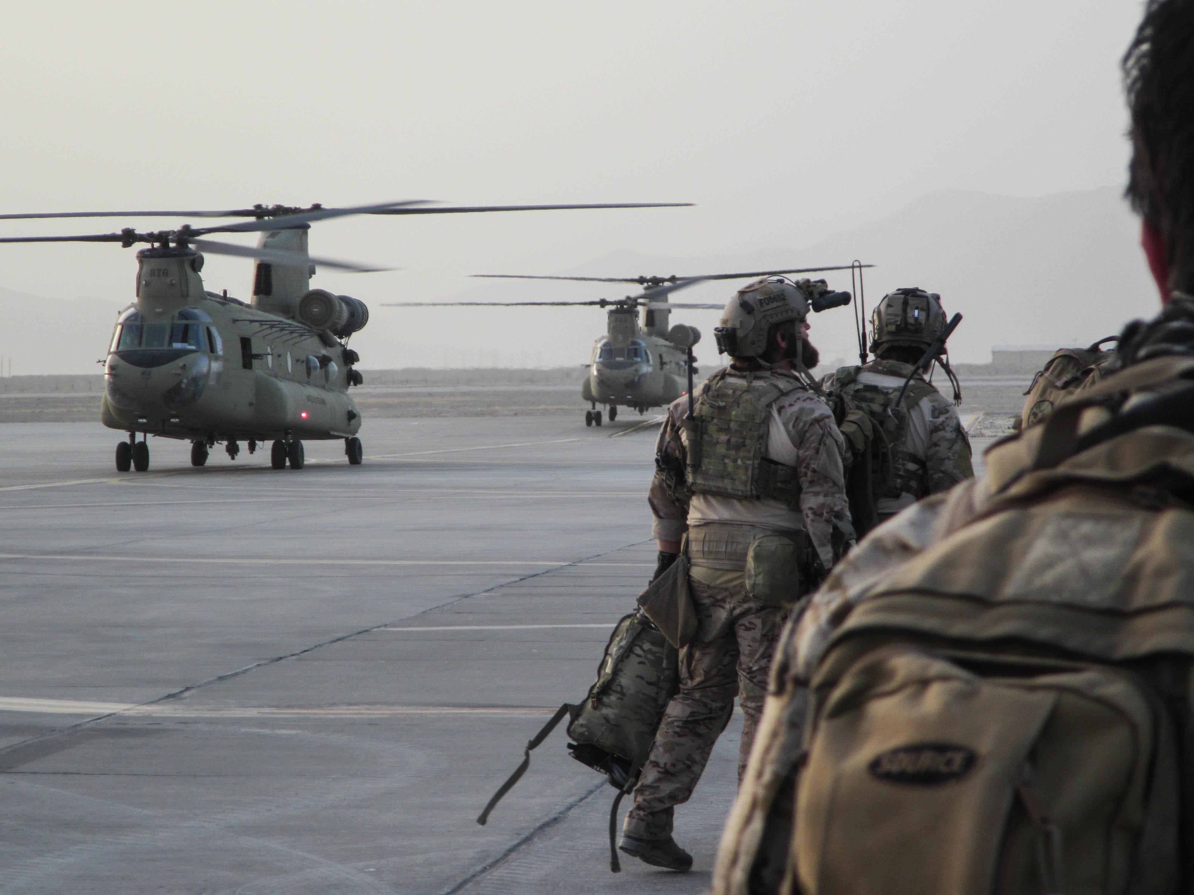U.S. Special Forces Soldiers, attached to Special Operations Task Force-Afghanistan, alongside Afghan agents from the National Interdiction Unit, NIU, prepare to load onto CH-47 Chinook Helicopters prior to an operation in the Ghorak district, Helmand province, Afghanistan, Sept. 12, 2016. The operation was conducted to disrupt and destroy drug labs owned by the Taliban in the area. (U.S. Army photo by Sgt. Connor Mendez/Reviewed)