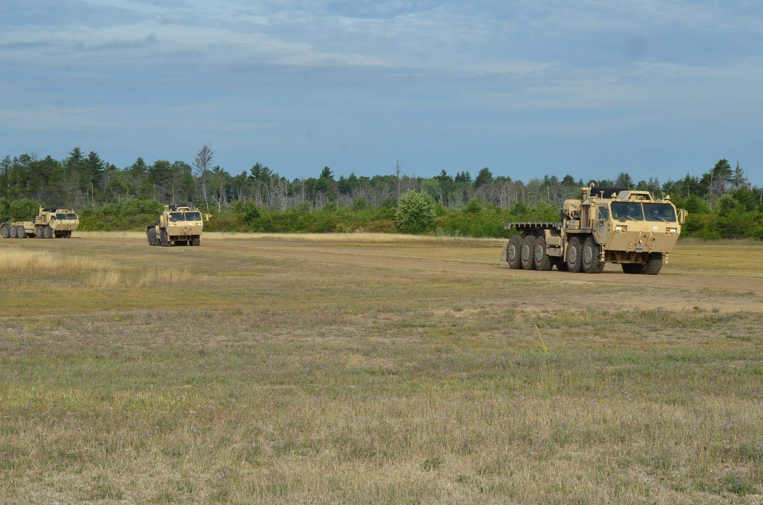 A convoy of optionally-manned trucks in Autonomous Leader-Follower mode navigate a roadway on Camp Grayling, Michigan, August 28, 2019. Engineers, scientists, Soldiers and program managers from the U.S. Army Ground Vehicle Systems