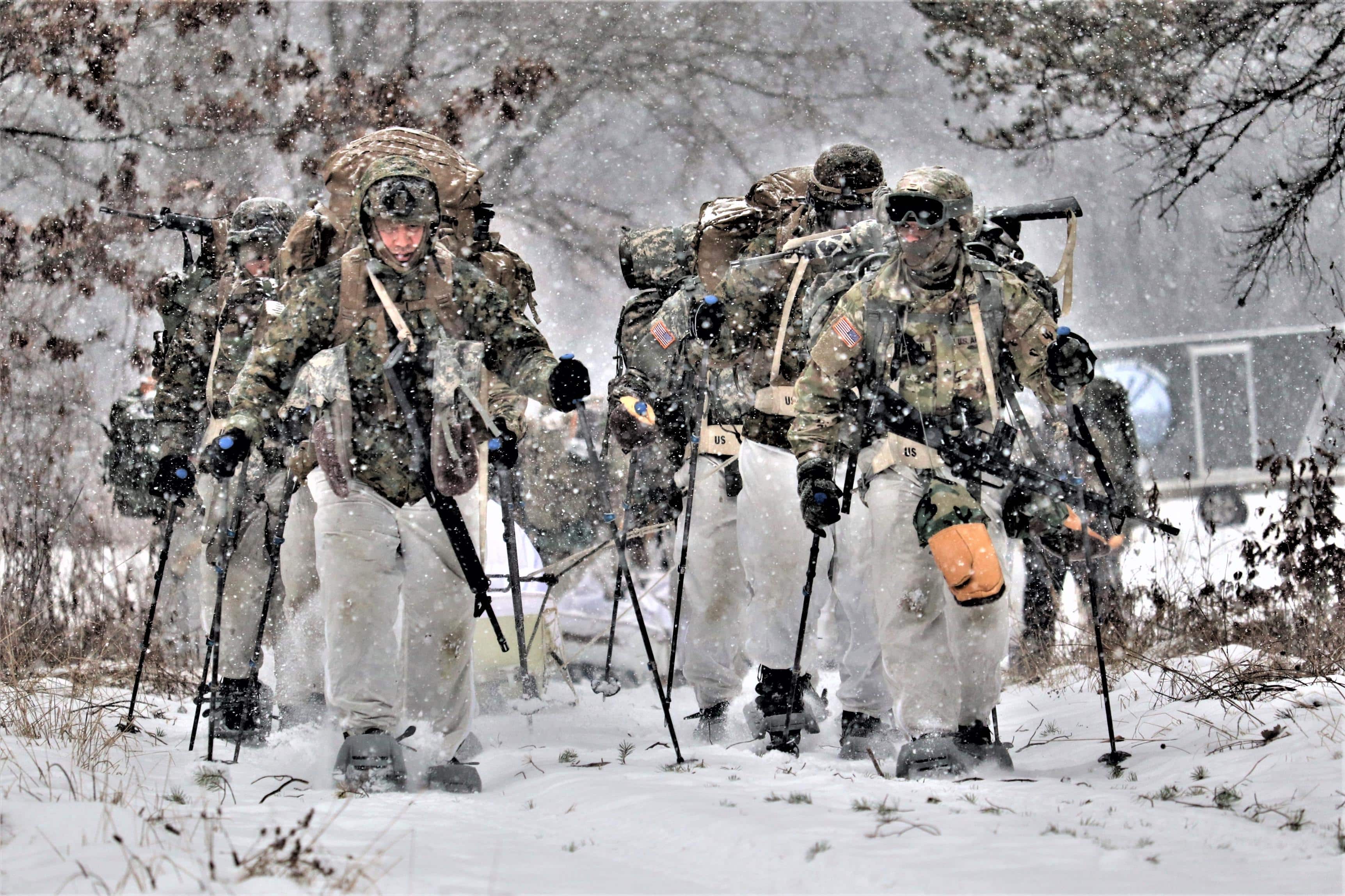Students, who include Army Reserve Soldiers, in Cold-Weather Operations Course Class 20-01 move through the snow and terrain on snowshoes during training Dec. 12, 2019, on North Post at Fort McCoy, Wis. CWOC students are trained on a variety of cold-weather subjects