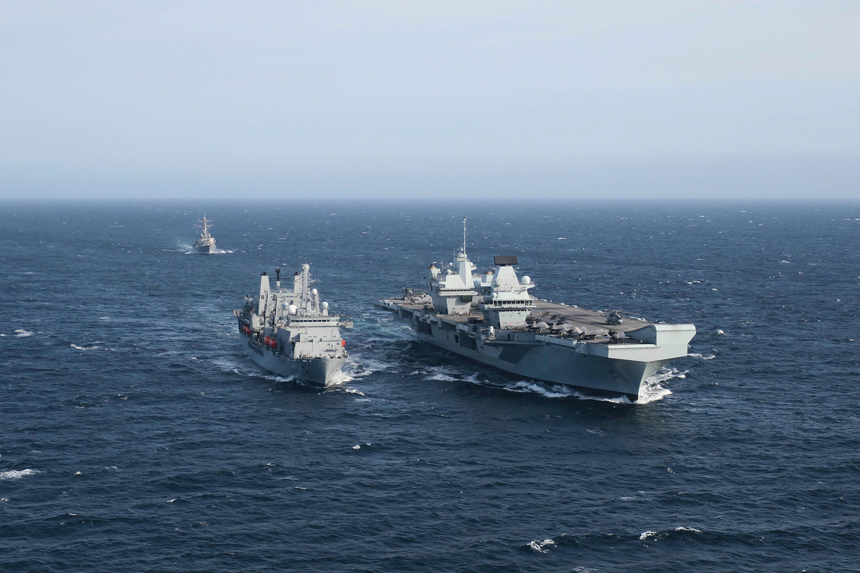 USS The Sullivans sails behind Her Majesty's Ship Queen Elizabeth as she conducted her first Replenishment at Sea (RAS) with RFA Fort Victoria in the North Sea on Sep 30 as part of Group Exercise 2020. RFA Fort Victoria has a crucial role to play in sustaining the reach, endurance and fighting power of Britain’s two new aircraft carriers, and their accompanying Strike Group. The 33,675 ton supply ship carries fuel, food, ammunition and other dry stores.