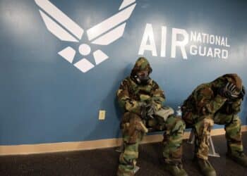 U.S. Air Force Staff Sgt. Wendy Kuhn, left, with the 121st Air Refueling Wing Public Affairs Office, awaits the "All Clear" while wearing an M50 gas mask during a Nuclear Operational Readiness Exercise, September 20, 2021, at Rickenbacker Air National Guard Base, Ohio. The NORE is to prepare Airmen for an upcoming Nuclear Operational Readiness Inspection (NORI). (U.S. Air National Guard photo by Tech Sgt. James Courtright)