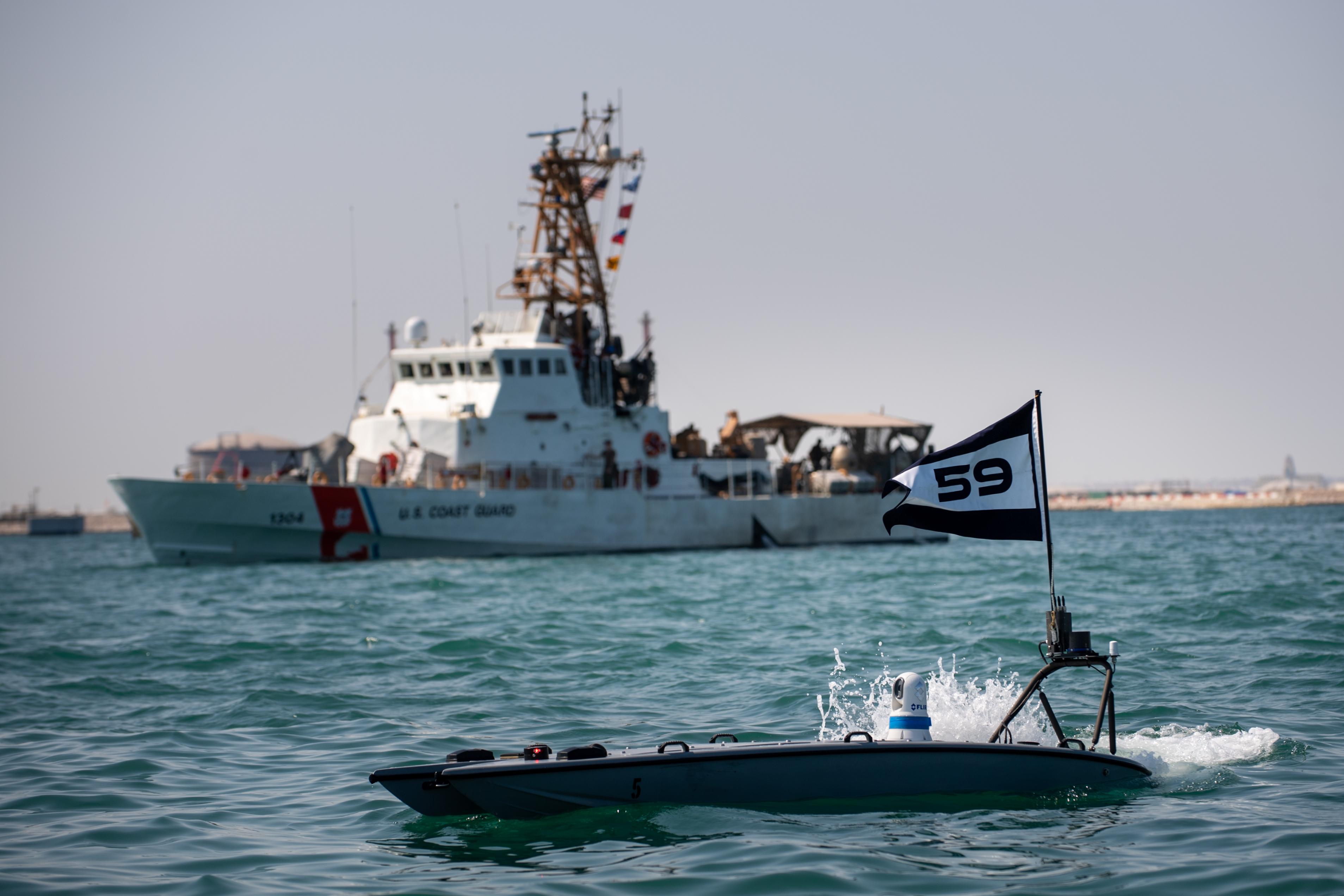 A MANTAS T-12 unmanned surface vessel (USV), front, operates alongside U.S. Coast Guard patrol boat USCGC Maui (WPB 1304) during exercise New Horizon in the Arabian Gulf, Oct. 26. Exercise New Horizon was U.S. Naval Forces Central Command Task Force 59’s first at-sea evolution since its establishment Sept. 9. (U.S. Navy photo by Mass Communication Specialist 2nd Class Dawson Roth)