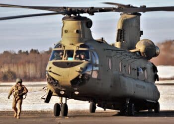 An aircrew with the 7th Battalion, 158th Aviation Regiment of New Century, Kansas, operates a CH-47 Chinook helicopter Feb. 7, 2022, at Fort McCoy, Wis., to support sling-load training for the 89B Ammunition Supply Course taught at Fort McCoy. The activity was on South Post at the Sparta-Fort McCoy Airport on a cold winter day.